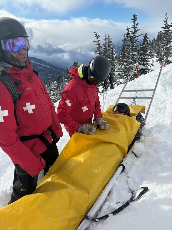 injured skier being taken away on sled